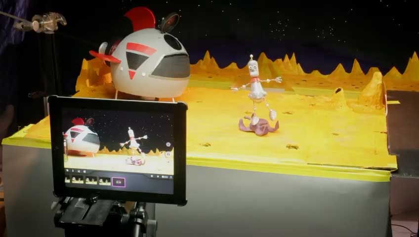 An iPad running Stop Motion Studio captures a handmade space scene in Apple’s Life on iPad film